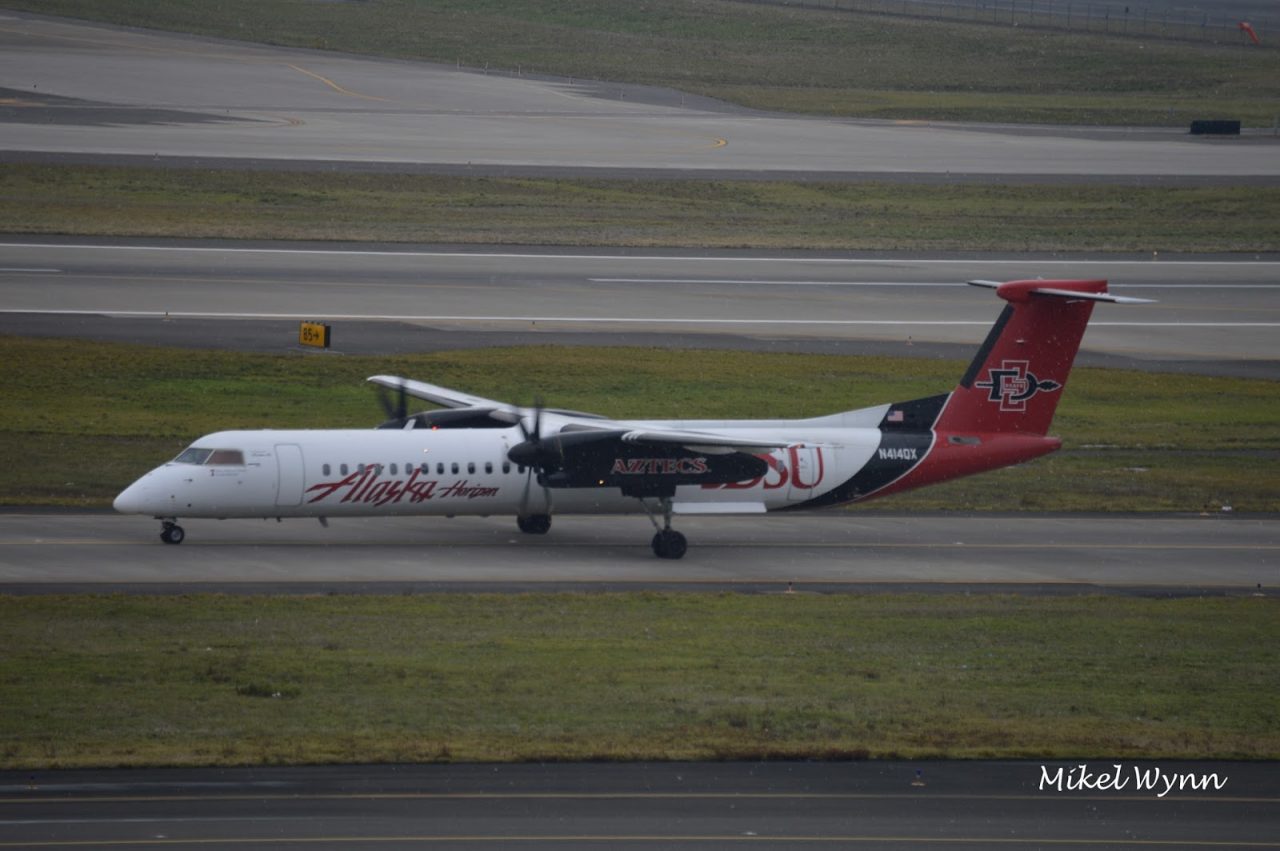 Horizon Air (d:b:a Alaska Airlines) Bombardier DHC-8-402 Dash 8 Q400 (N414QX) in the San Diego State University Aztecs livery taxiing to the gate @Mikel Wynn