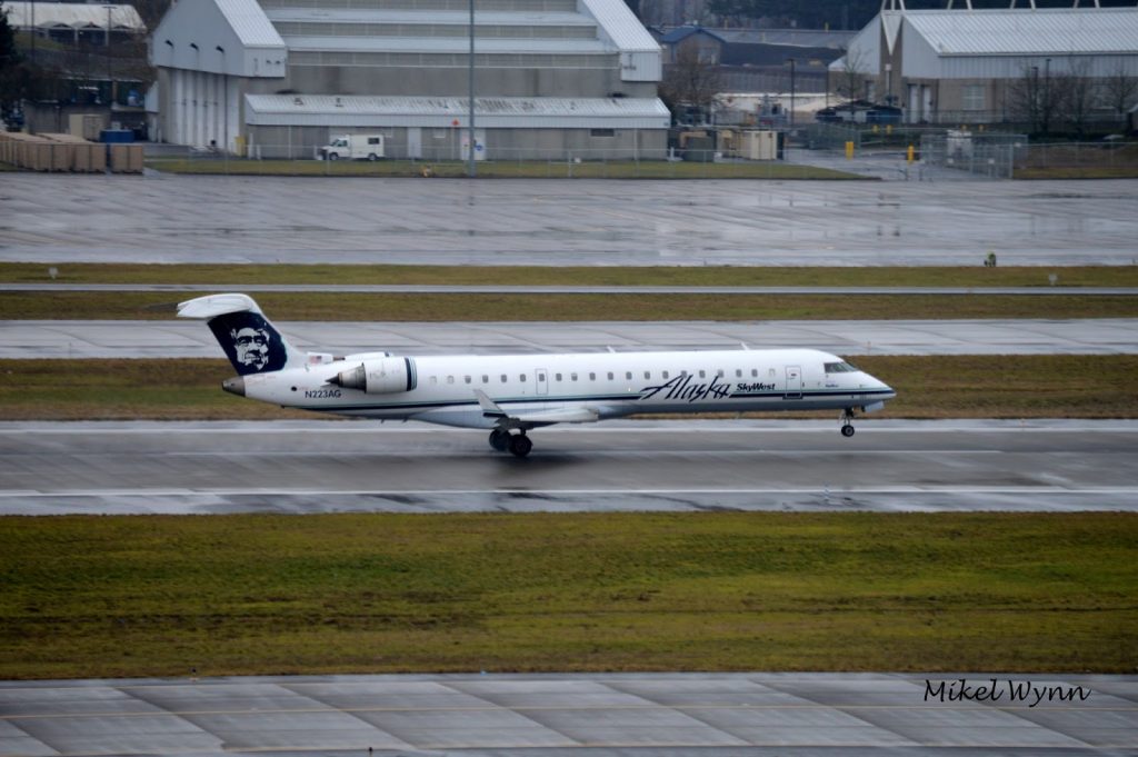 SkyWest Airlines (d:b:a Alaska Airlines) Bombardier CL-600-2C10 CRJ-700 (N223AG) rotating on 28L for departure as SKW3342 to Seattle:Tacoma credit - Mikel Wynn