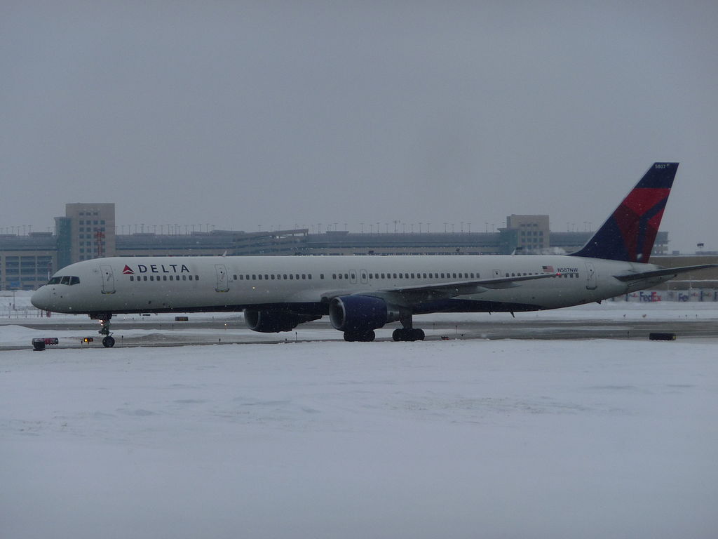 Delta Air Lines Aircraft Fleet N587NW, Boeing 757-300 with the Pratt & Whitney PW2043 engines Taxiing on snowy runway at Minneapolis–Saint Paul International Airport