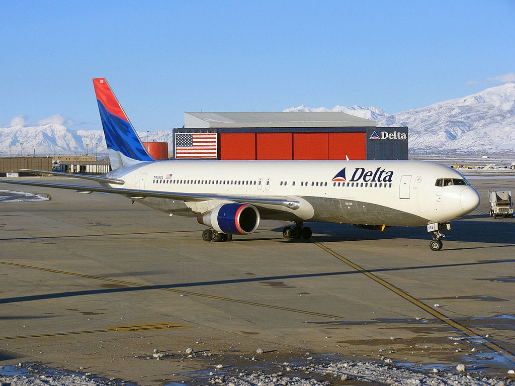 Delta Air Lines Boeing 767-300 (N138DL) at Salt Lake City Int'l Airport with Delta hangar also shown