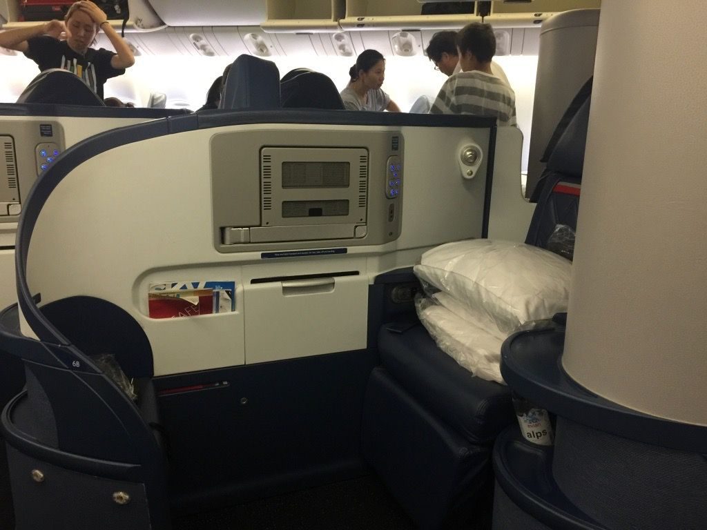 Delta Air Lines Fleet Boeing 777-200ER Business Elite Class (DELTA ONE) cabin aisle and seat row view