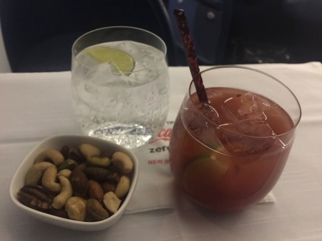 Delta Air Lines Fleet Boeing 777-200ER Business Elite Class (DELTA ONE) inflight drink cart Bloody Mary and some Pellegrino with heated nuts