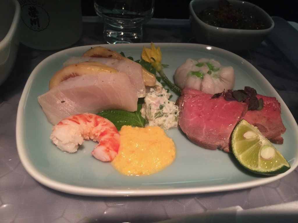 Delta Air Lines Fleet Boeing 777-200ER Business Elite Class (DELTA ONE) inflight food services stuffed shrimp and fish here were really good among the various small starters