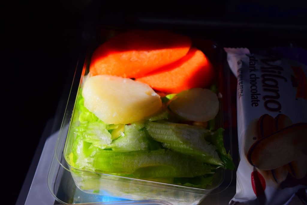 Delta Air Lines Fleet Boeing 777-200ER Premium Economy (Comfort+) inflight amenities salad with water chestnuts on top service