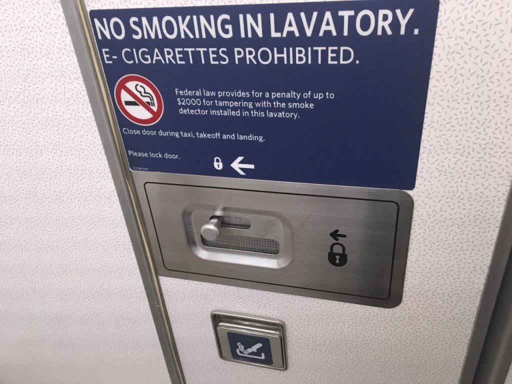 Delta Air Lines Fleet Boeing 777-200LR Main cabin economy class no smoking sign on lavatory bathroom photos