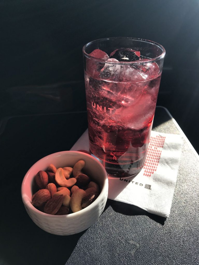 United Airlines Fleet Boeing 737-900 Business:First Class:United First Inflight Amenities Beverage Services Cranberry Juice and Warm Nuts