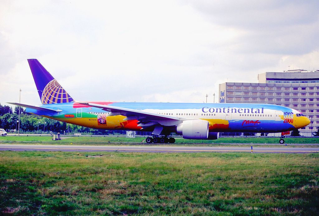 United Airlines Aircraft Fleet ex Continental N77014 Boeing 777 200ER on 22Peter Max22 livery colors at Paris Charles de Gaulle Airport