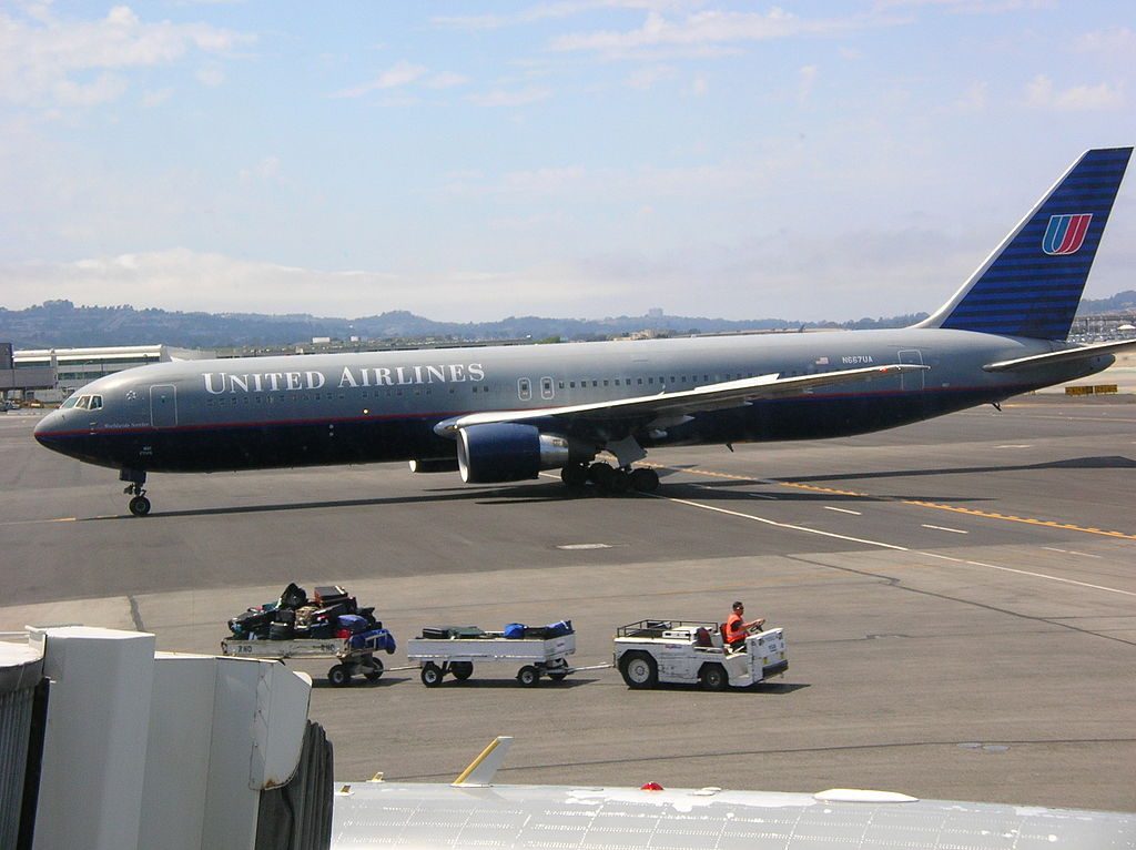 United Airlines Fleet Boeing 767 322ER tail number N667UA old battleship livery taxiing at San Francisco International Airport SFO
