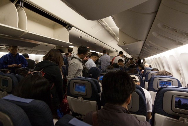 United Airlines Fleet Widebody Aircraft Boeing 777 200 Economy Class cabin long haul flight inflight passenger deplaned after landing