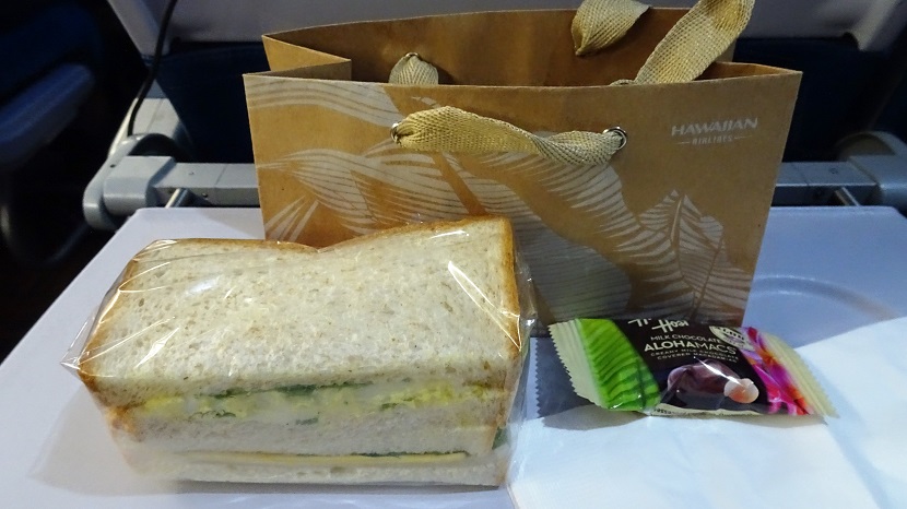 Airbus A330 200 Hawaiian Airlines Economy Class Cabin Inflight Snack sandwich half egg salad half turkey cheese macadamia nut candy 1