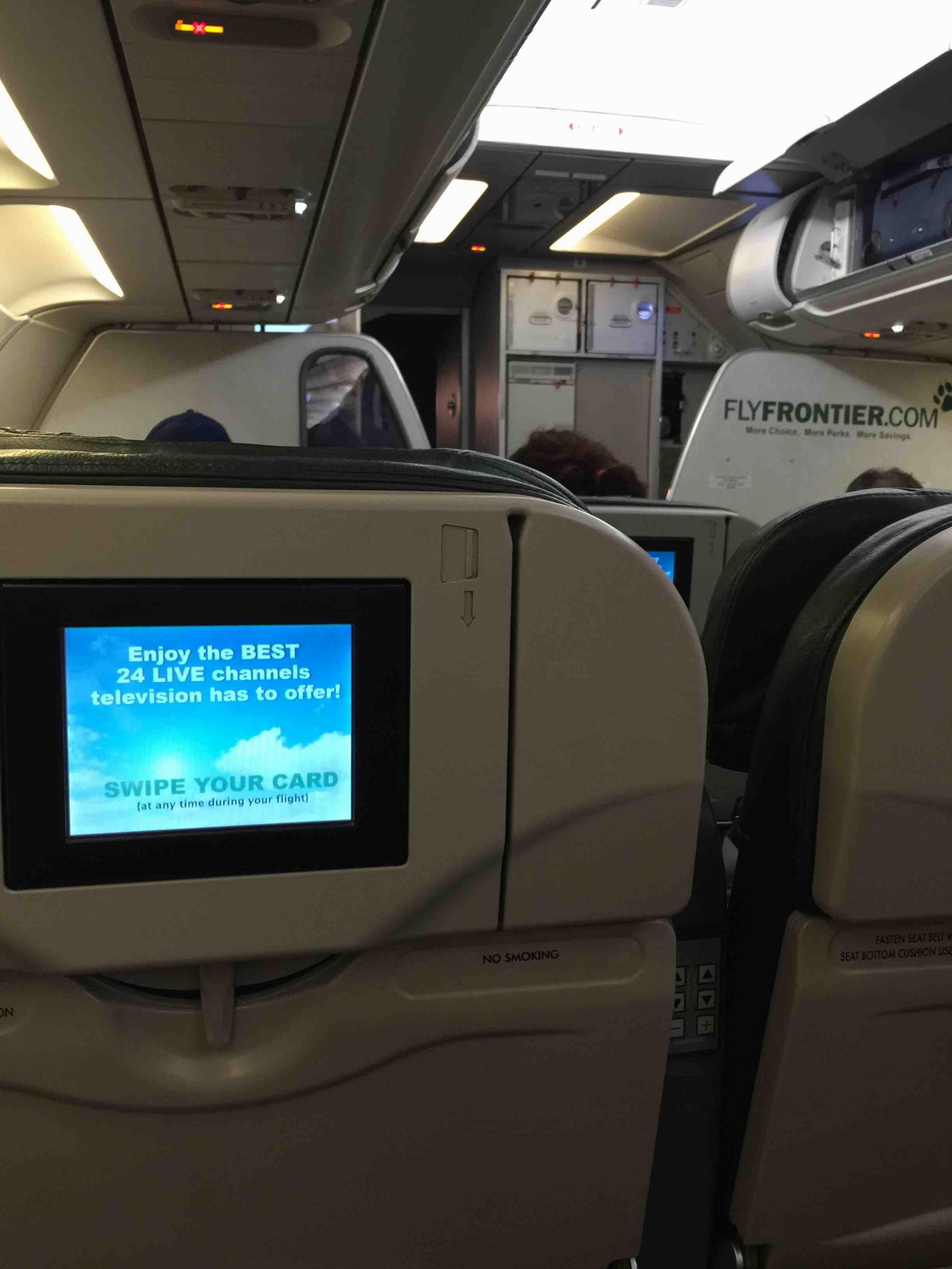 Frontier Airlines Airbus A319 100 cabin interior inflight entertainment system DirectTV on seatback