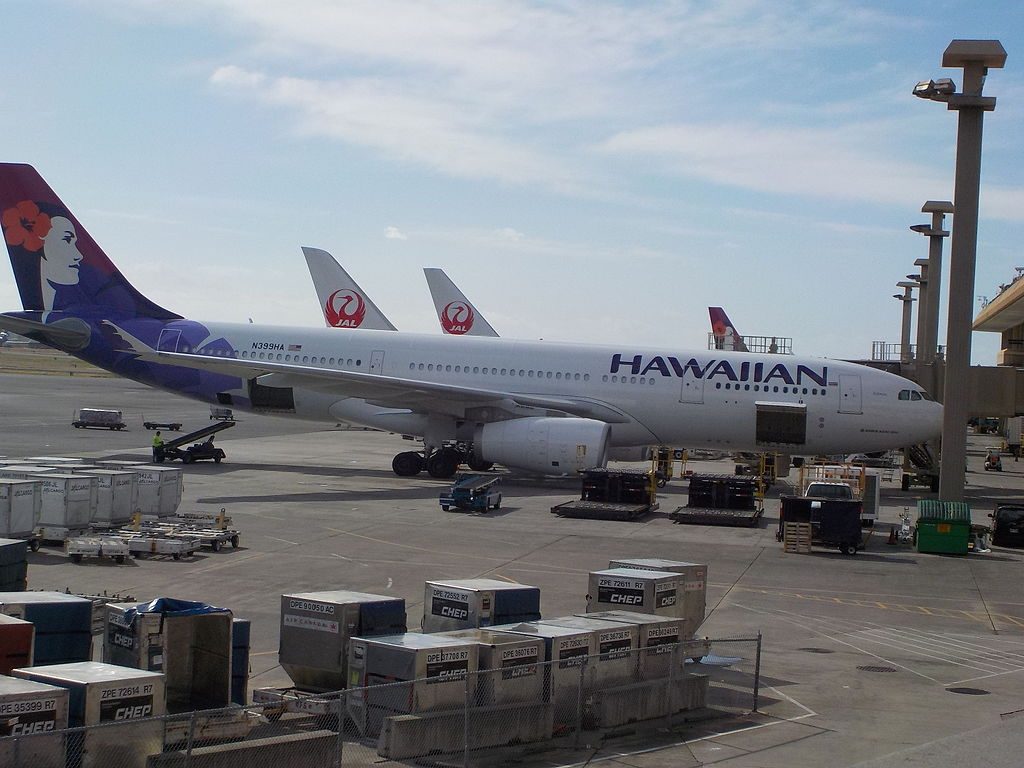 Hawaiian Airlines Fleet Airbus A330 243 N399HA Kūmau parking on boarding gate at at Honolulu International Airport