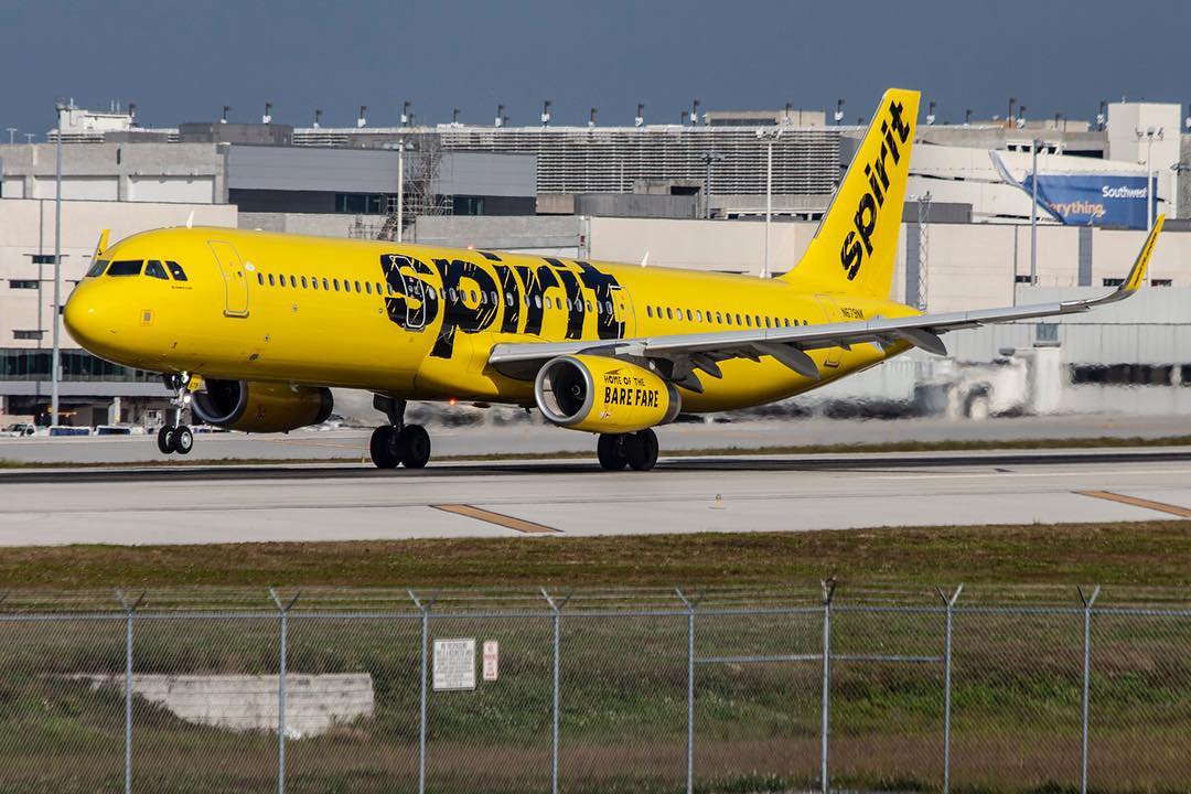 Spirit Airlines Airbus A321 200 N679NK departs on runway 28L at FLL Airport