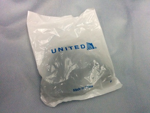 United Airlines Aircraft Fleet Boeing 787 9 Dreamliner Economy Class Cabin Inflight Amenities headphone was distributed before push back