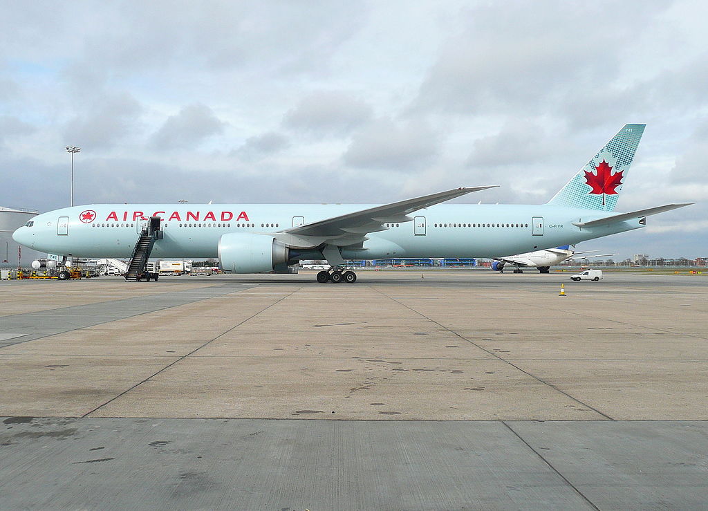Air Canada Boeing 777 300ER C FIVR on std 595 next to the fuel farm at London Heathrow Airport
