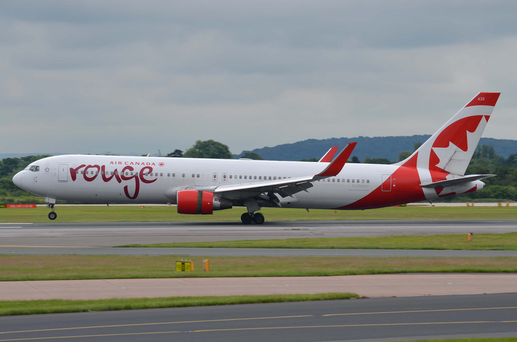 Air Canada Rouge Fleet C FMWY Boeing 767 300ER landing at Manchester Airport