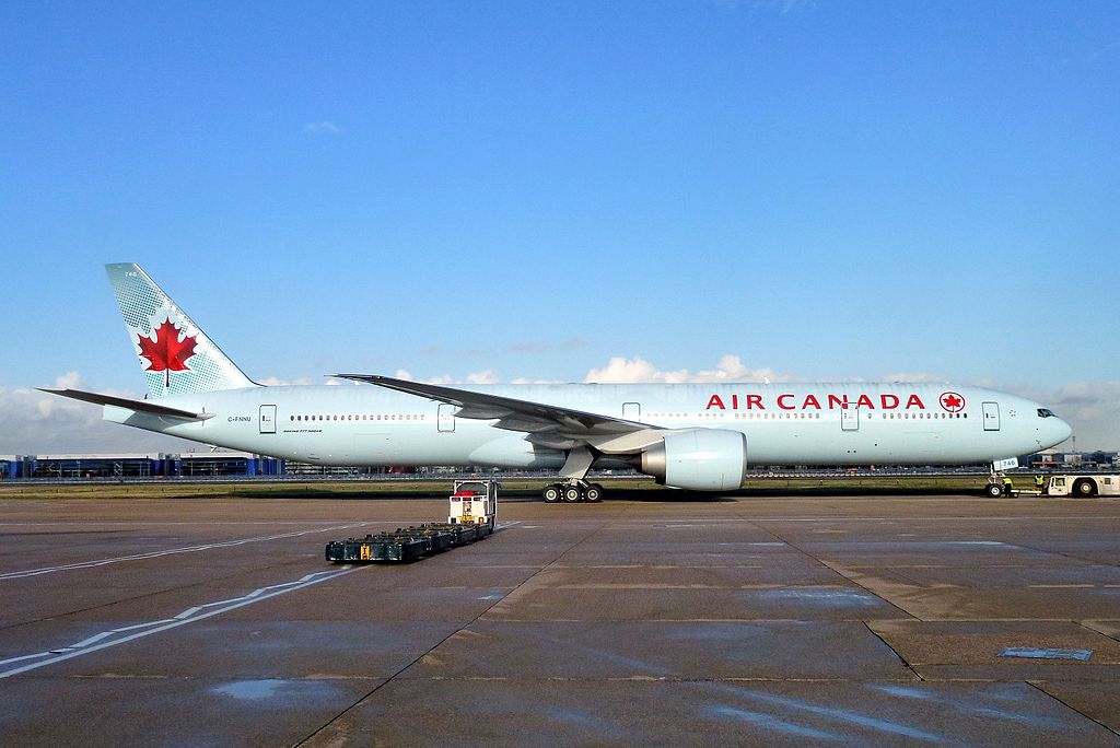 Boeing 777 300ER of Air Canada C FNNU pushed back off std 334 at LHR