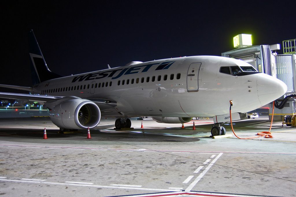 WestJet Boeing 737 700 C GRWS parking at Vancouver International Airport
