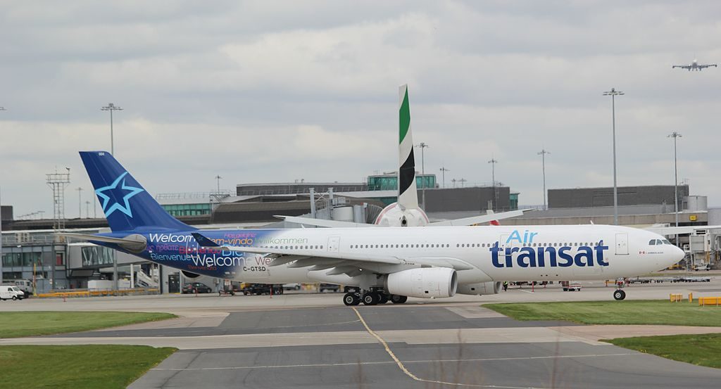 Air Transat Airbus A330 300 C GTSD taxiing on runway at Manchester Airport