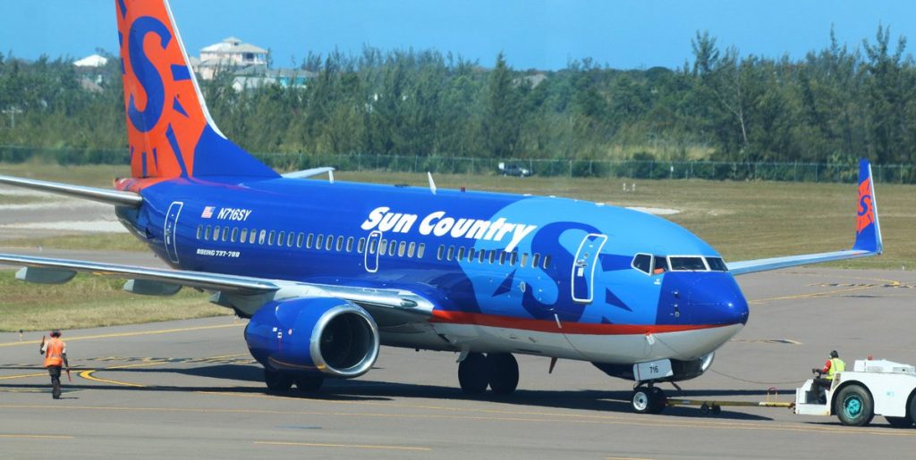 Sun Country Boeing 737 700 N716SY Pushed back by airport tug
